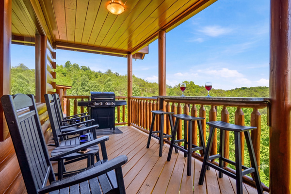 Stretch out on the main deck with rocking chairs, a grill, and a deck bar. An inviting outdoor space for morning coffee, family meals, and quiet evenings.