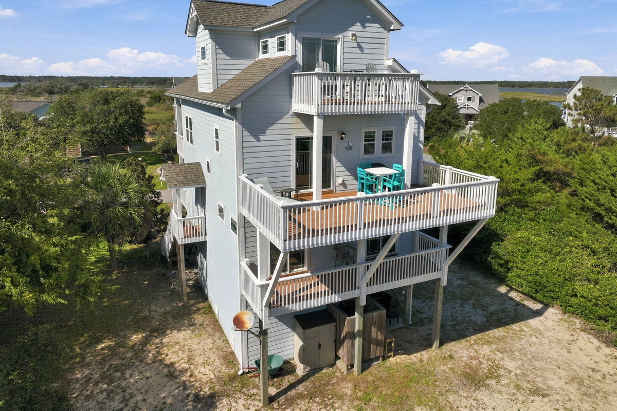 Beautiful coastal home featuring multiple levels of outdoor decking and inviting spaces to unwind