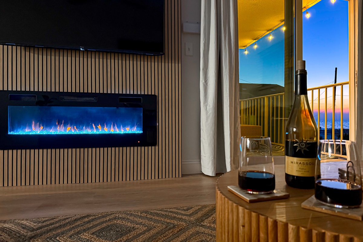 Pour a glass of wine and relax at the handmade wood coffee table. The large sliding doors open wide to let the salt air into the room.