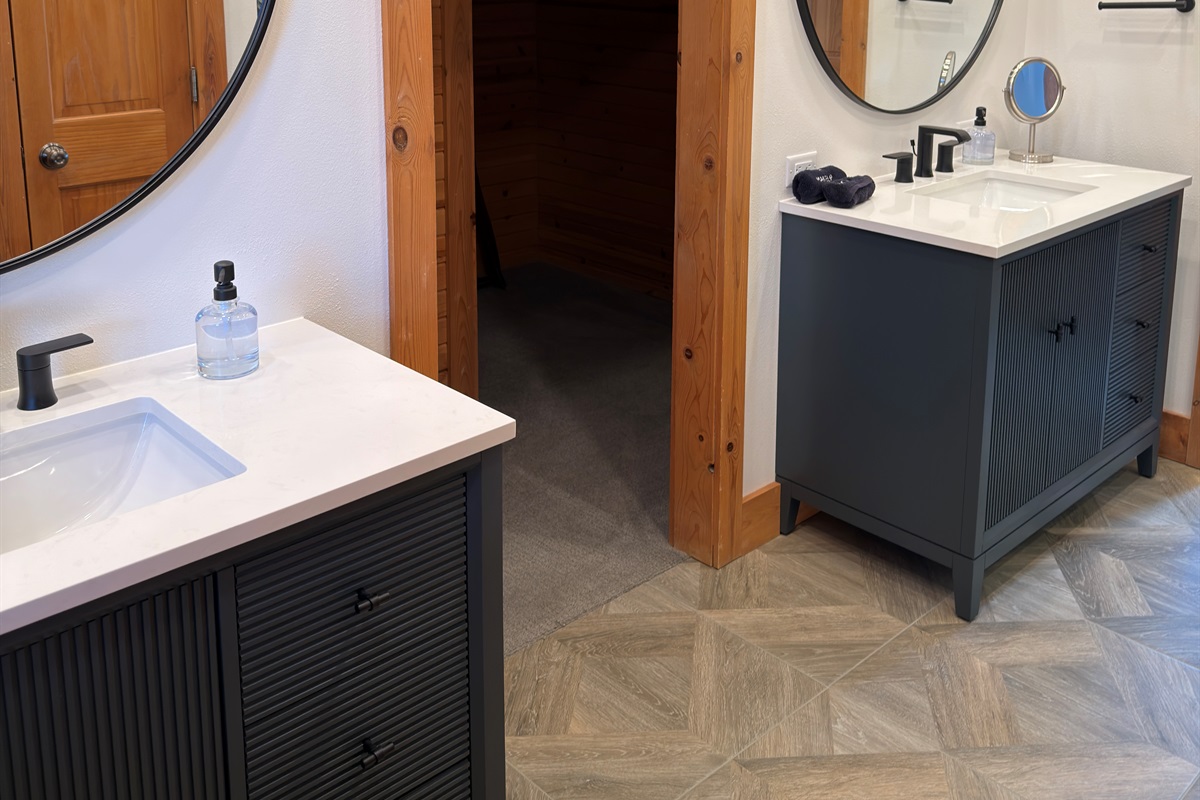 Newly installed vanities, Kohler faucets and tile floors in the main floor Master Suite.