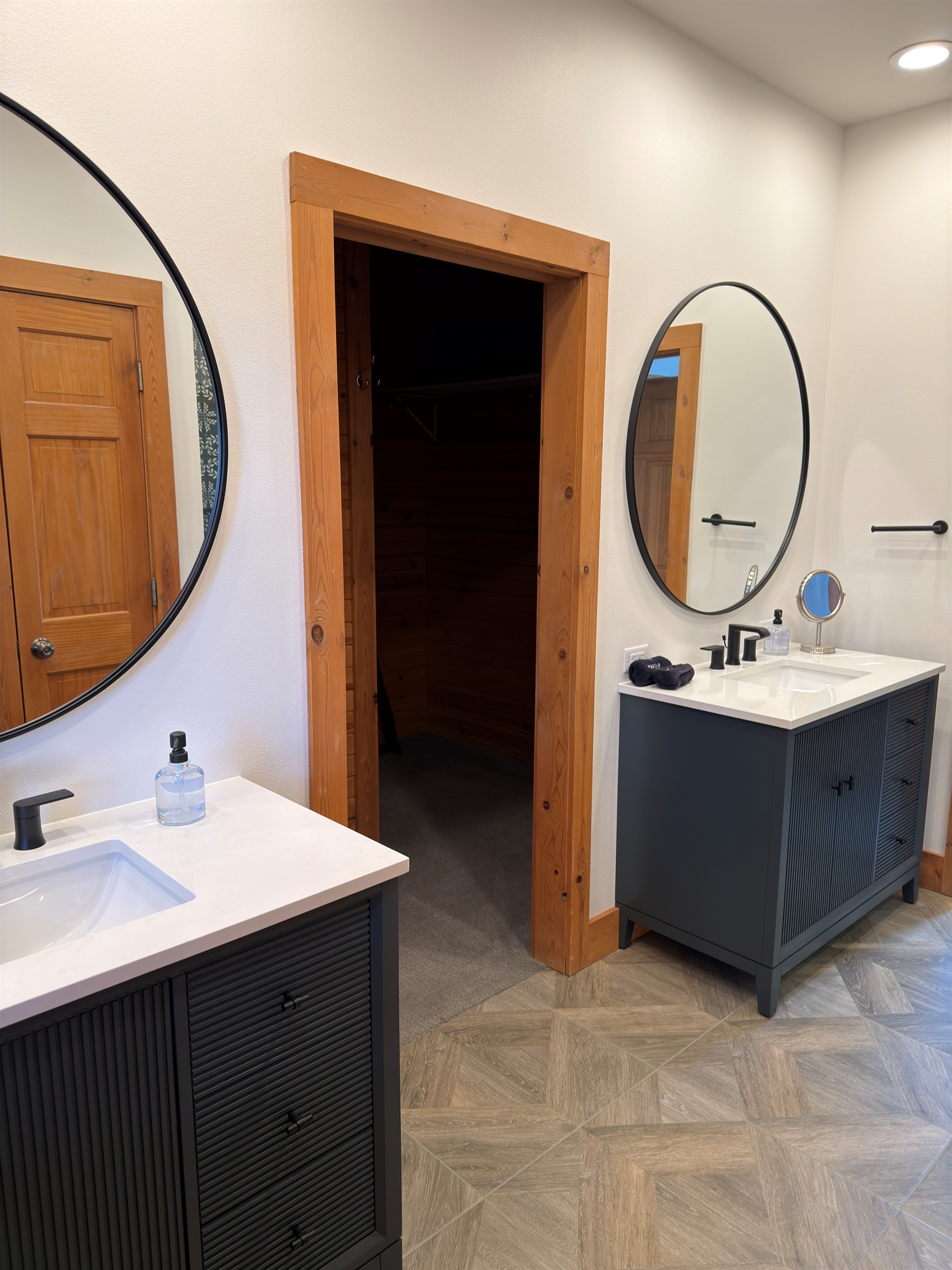 Newly installed vanities, Kohler faucets and tile floors in the main floor Master Suite.