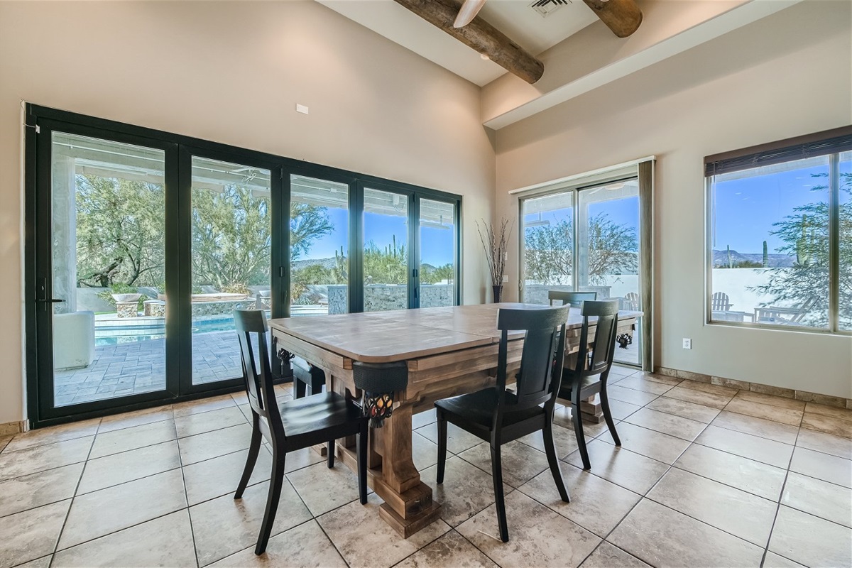 Dining area bench seating and four chairs (pool table underneath)