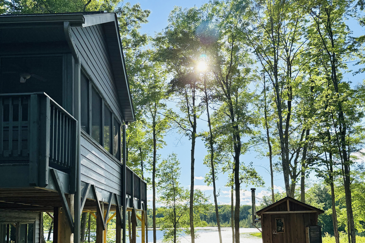 Our authentic wood burning sauna with a great view of the lake.