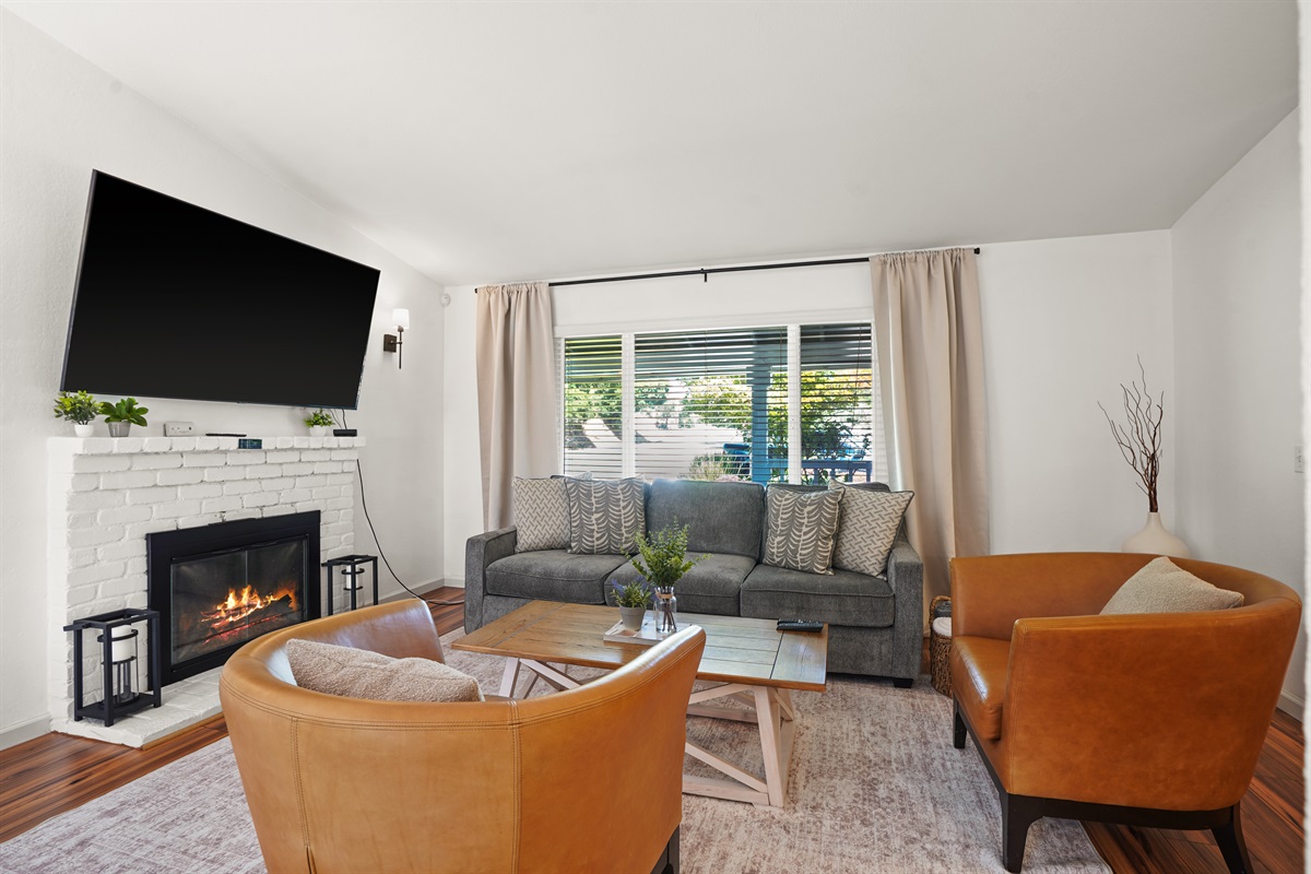 A living room that feels both elevated and effortless, with warm textures, natural light, and room to truly unwind.