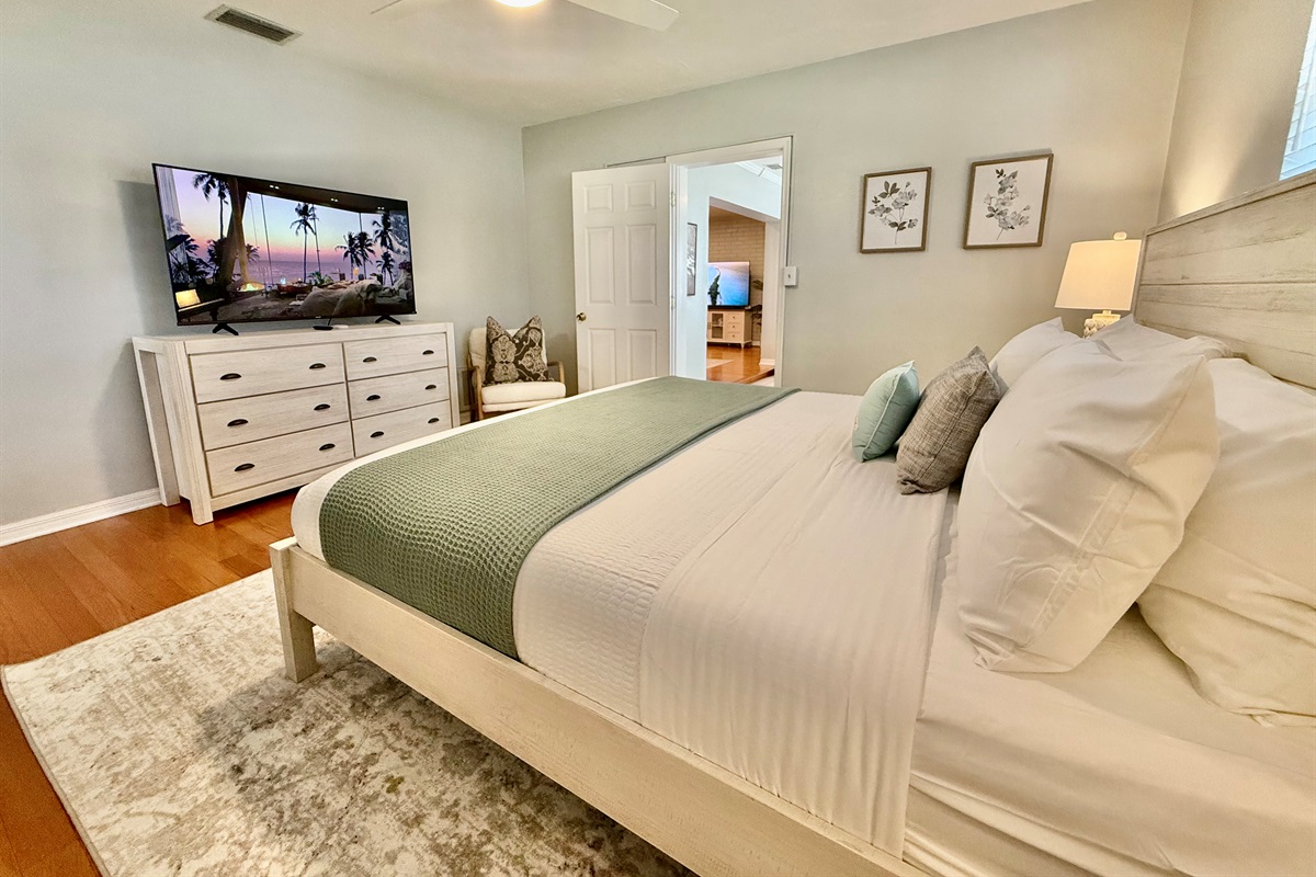 Unwind in this bright and airy master suite, complete with a king bed, Smart TV, and cozy seating nook.