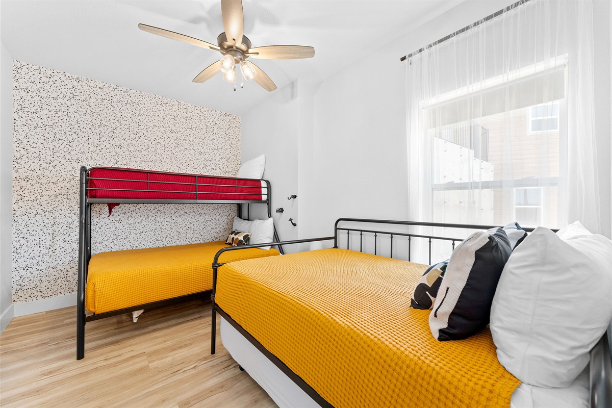 Lower level bedroom w/ trundle, full, and twin beds