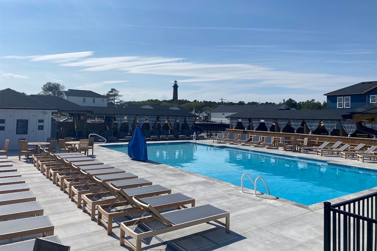 Enjoy sunny afternoons at the spacious heated neighborhood pool with plenty of lounge seating.