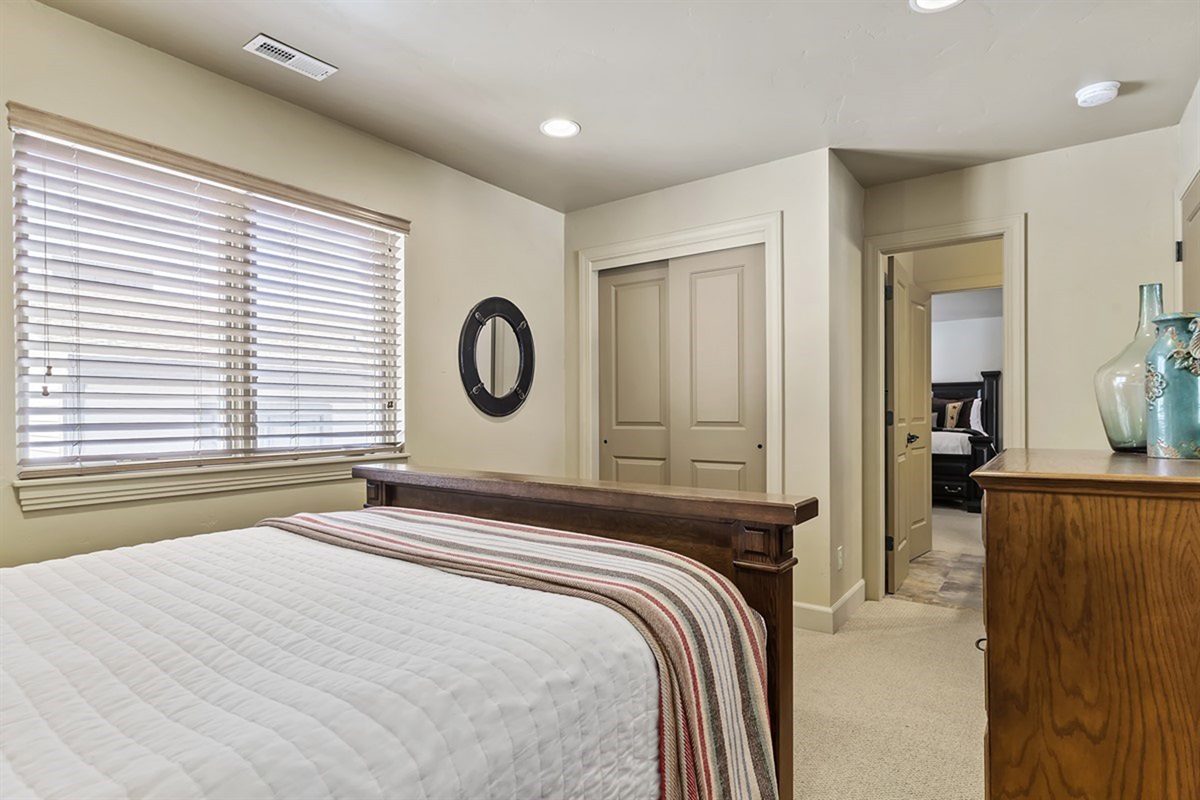 Upstairs bedroom filled with natural light and designed for comfort and relaxation.