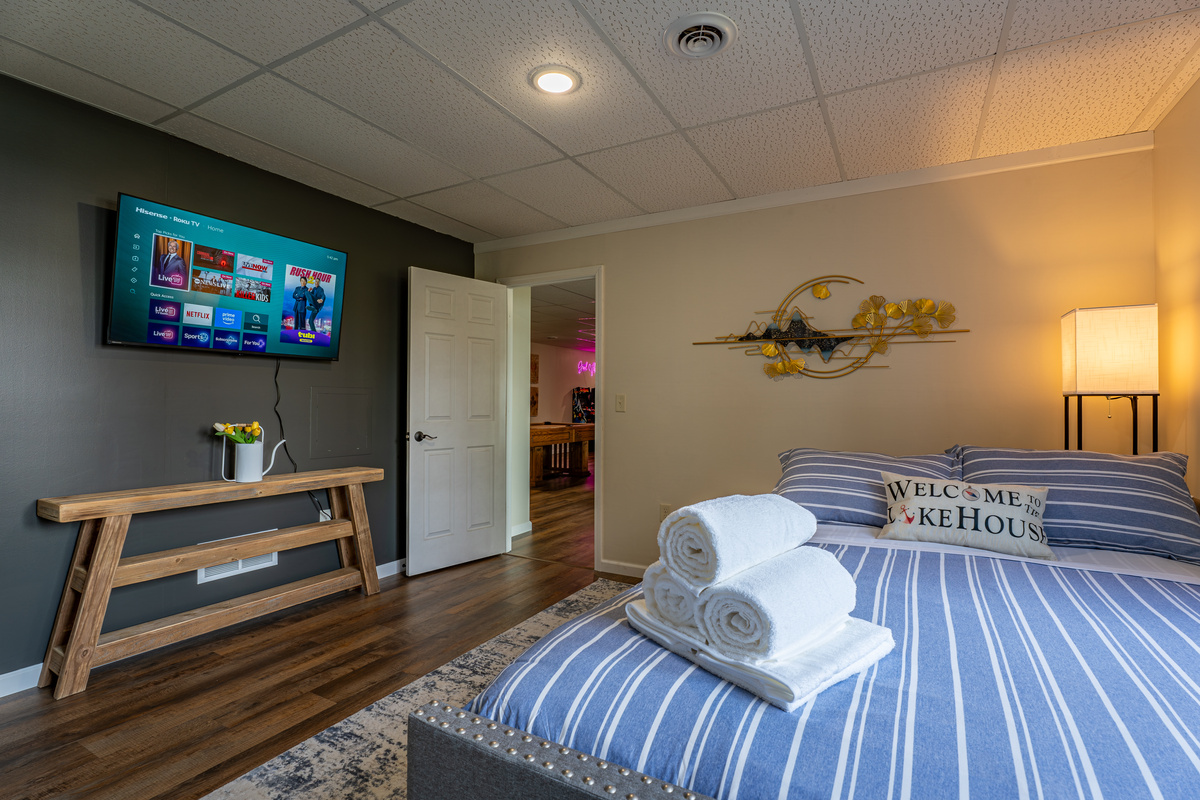 A private queen trundle daybed is available in the basement with an en-suite bathroom and Smart Roku TV