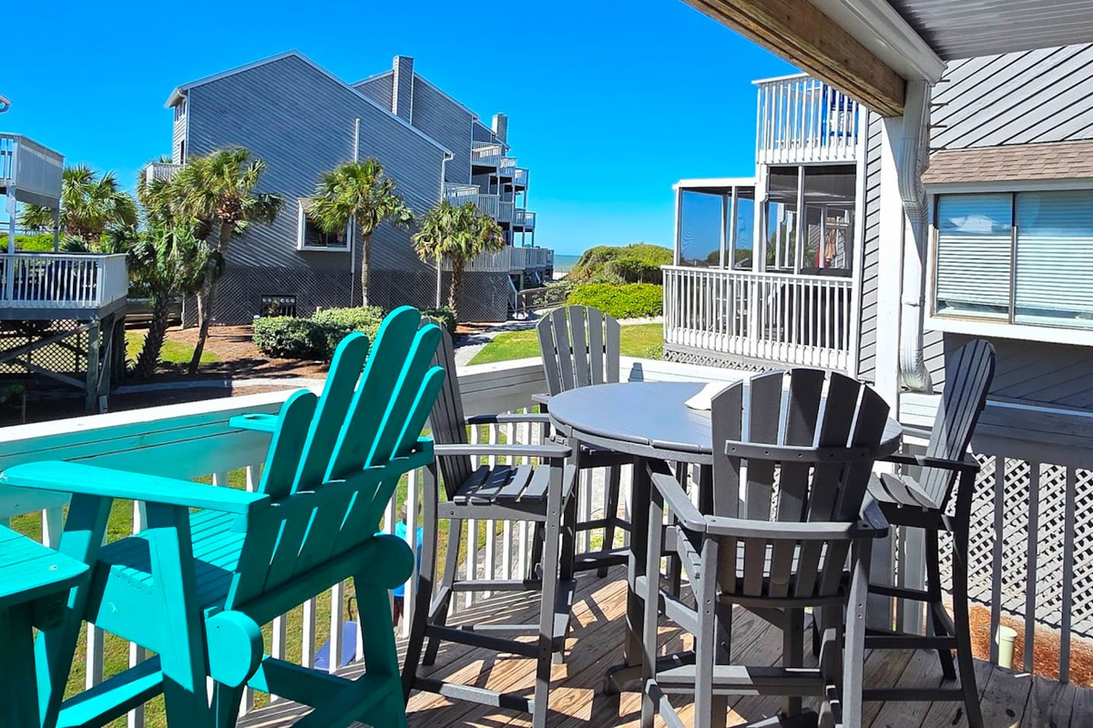 Pull up to the outdoor dining set or sink into an Adirondack &mdash; the main deck has room for the whole group to eat, drink, and watch the afternoon unfold.