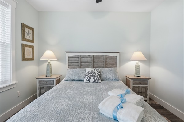 Kick back and read a book in the second queen bedroom at the end of the day.