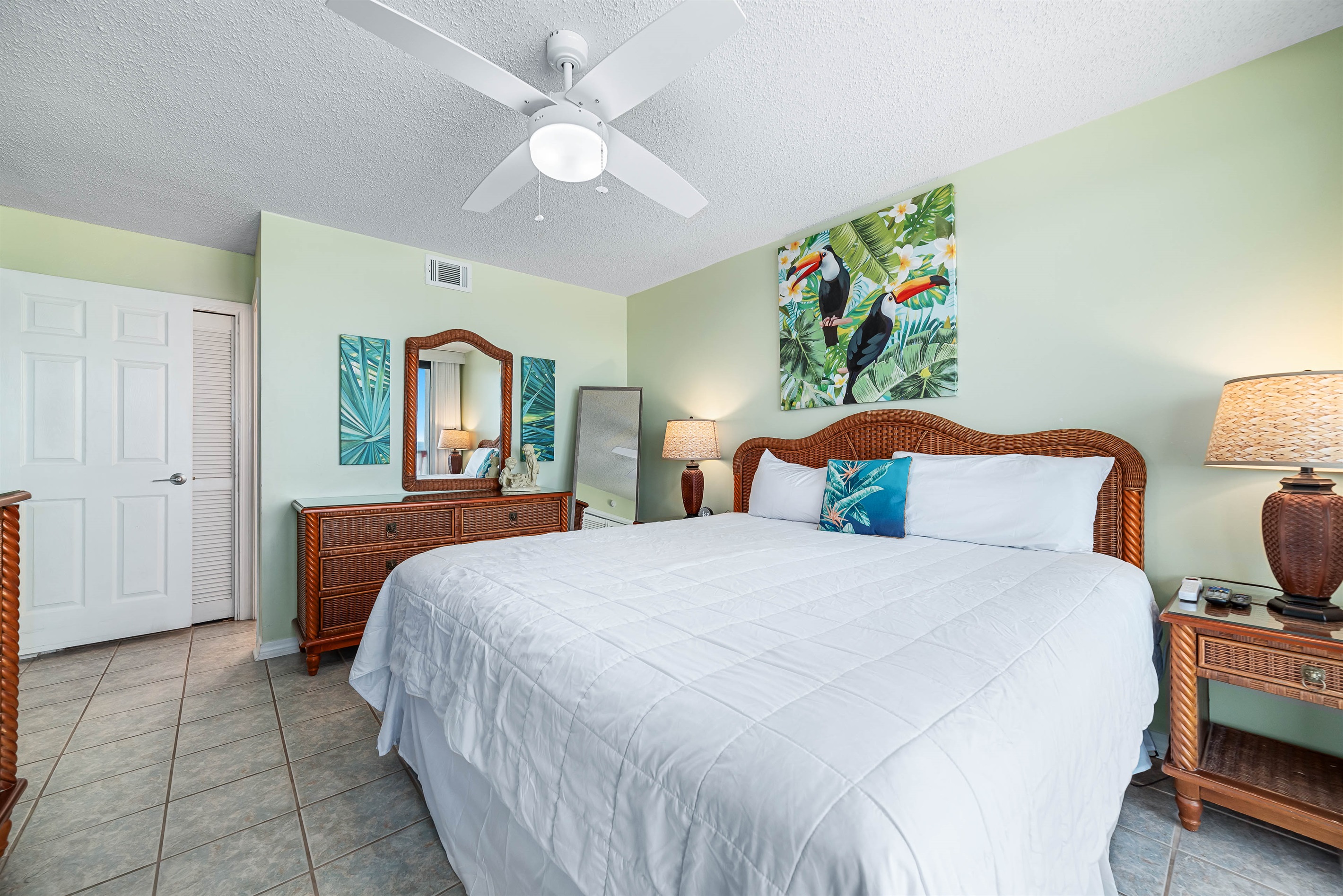 This spacious bedroom offers a comfortable king-size bed and a private balcony overlooking the mesmerizing ocean.