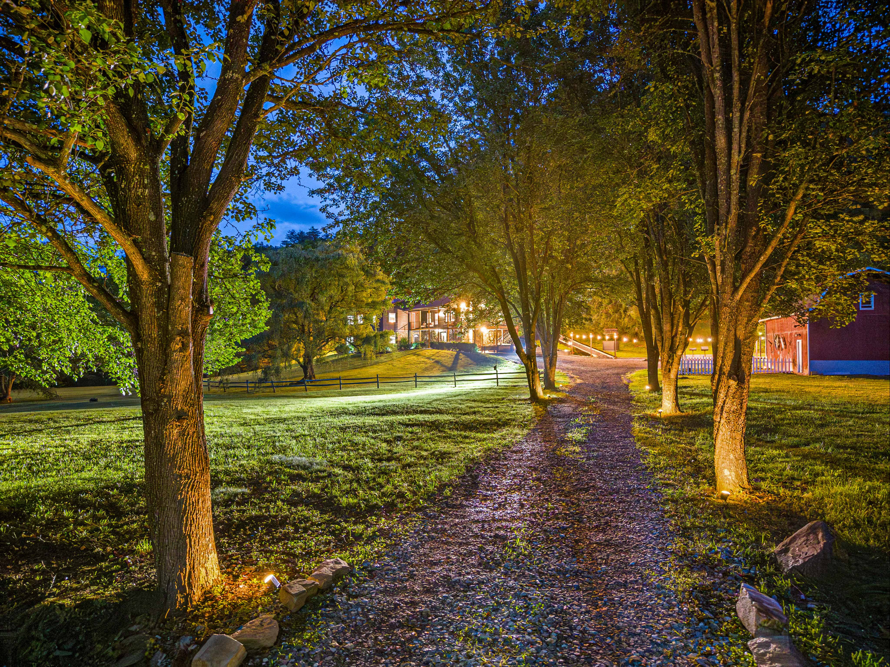 Exterior: Stroll the enchanting path lined with trees, leading to your tranquil retreat!
