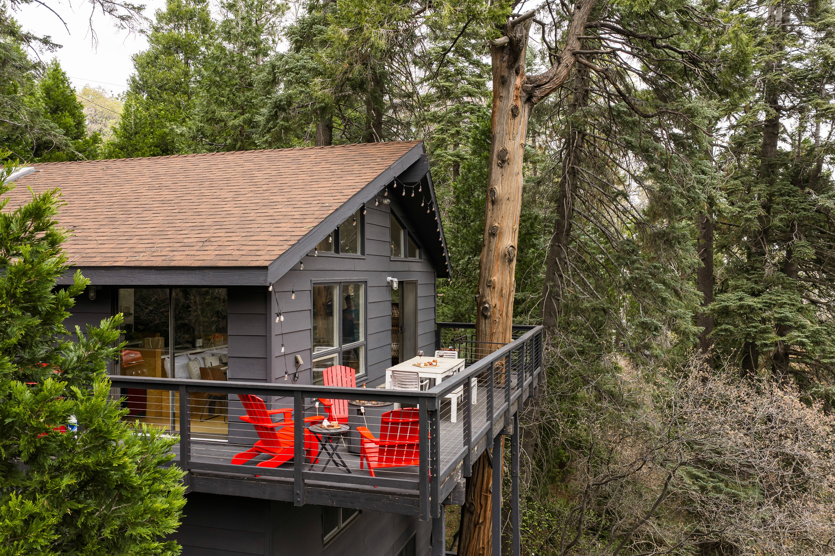Secluded mountain cabin surrounded by towering pines, offering a private, peaceful escape in Lake Arrowhead. 