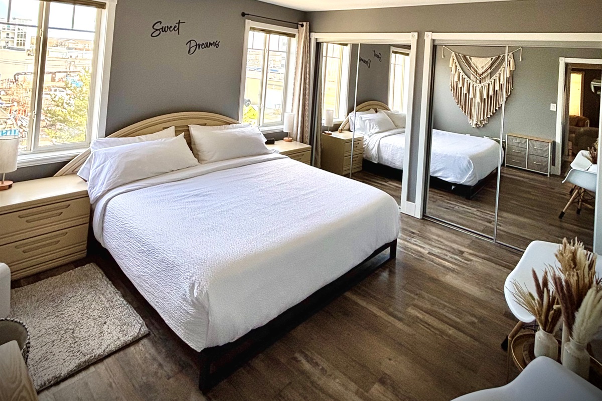 Master bedroom with a king-size bed