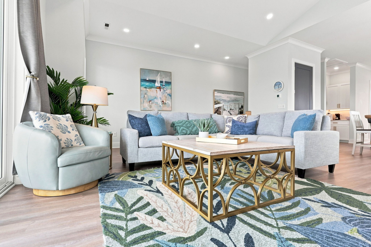 Enjoy open-concept coastal living with a bright space designed for conversations, movie nights, and making vacation memories together