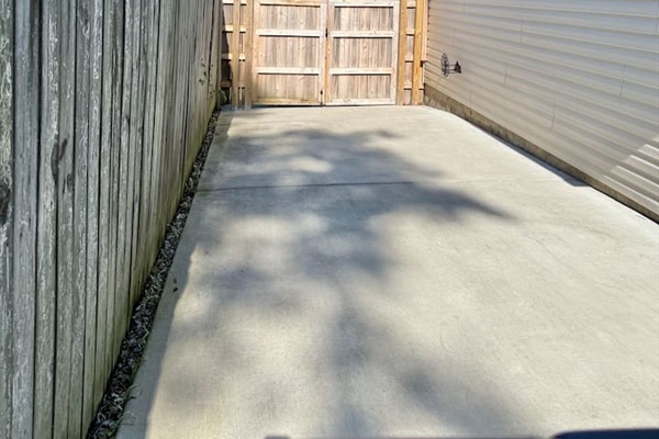 Additional parking for small to medium sized vehicles. This is the view of the gate from the back yard. The other side of the gate is the driveway that holds 2 cars. 