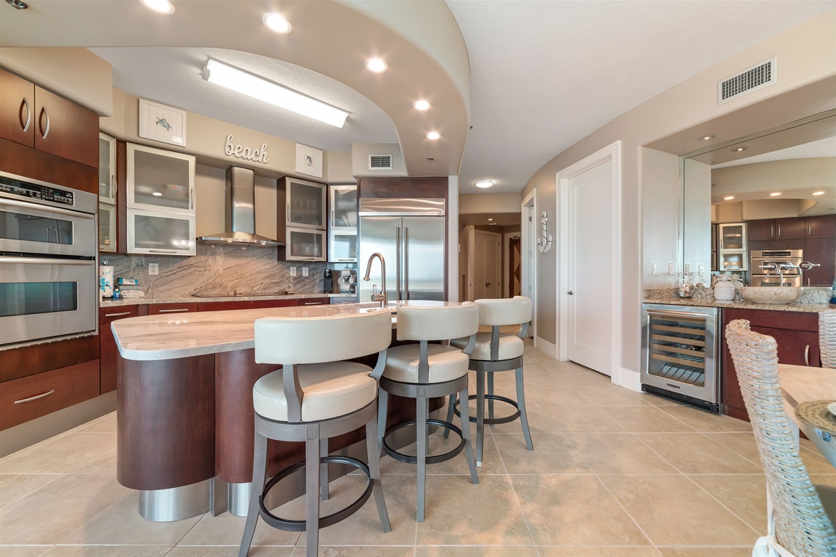 Effortless flow and abundant natural light characterize this stunning condo. The kitchen's thoughtful design and open layout create an inviting atmosphere for both cooking and gathering.