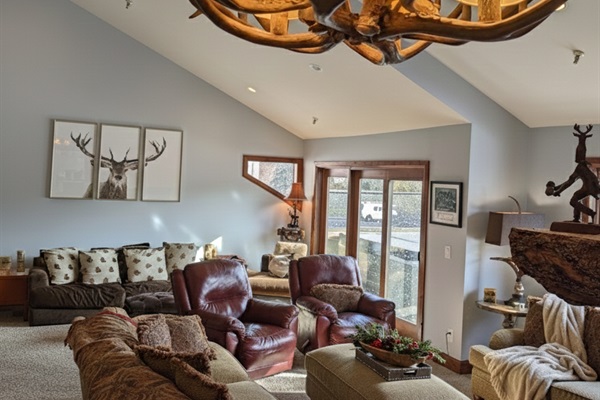 The main living room area opens up onto a balcony deck area where there is a private hot tub for your use as well as a propane grill.