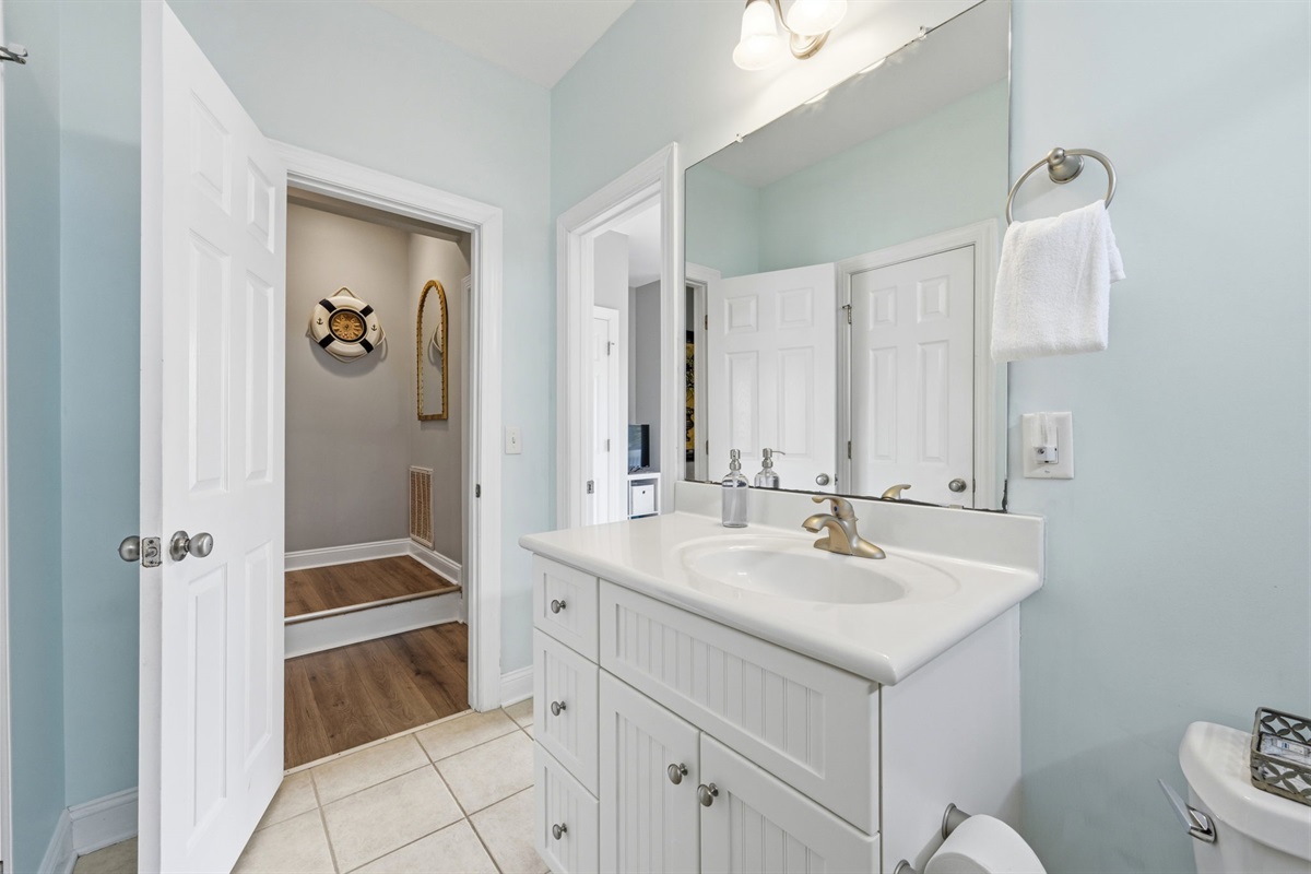 2nd floor bathroom with vanity, storage, and hallway access