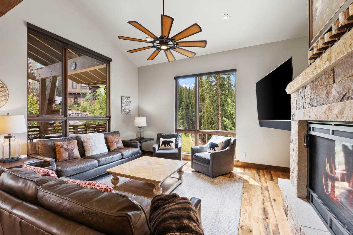 Main living area with gas fireplace and mountain views