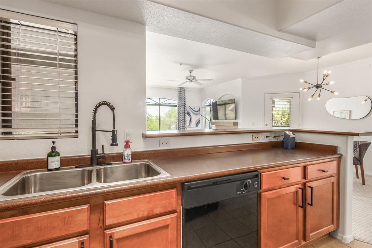   Kitchen with full-size fridge, stove, dishwasher, and plenty of counter space for daily use
