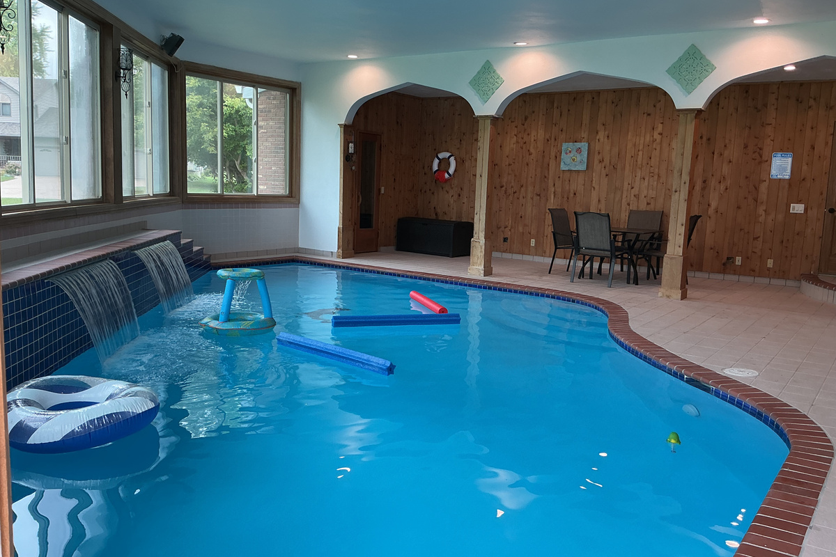 Indoor pool room with table/chairs