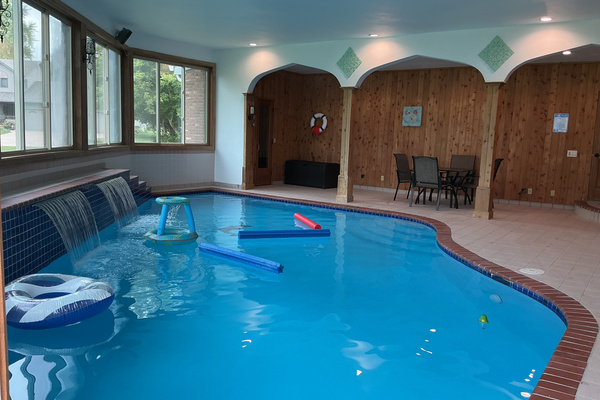 Indoor pool room with table/chairs