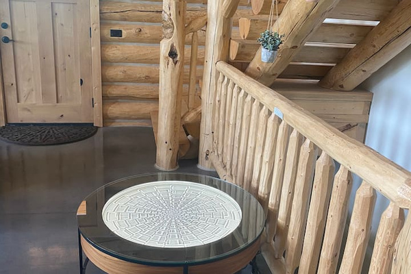 Sisyphus table in the open concept living room. (Instructions on how to change designs in the house manual)