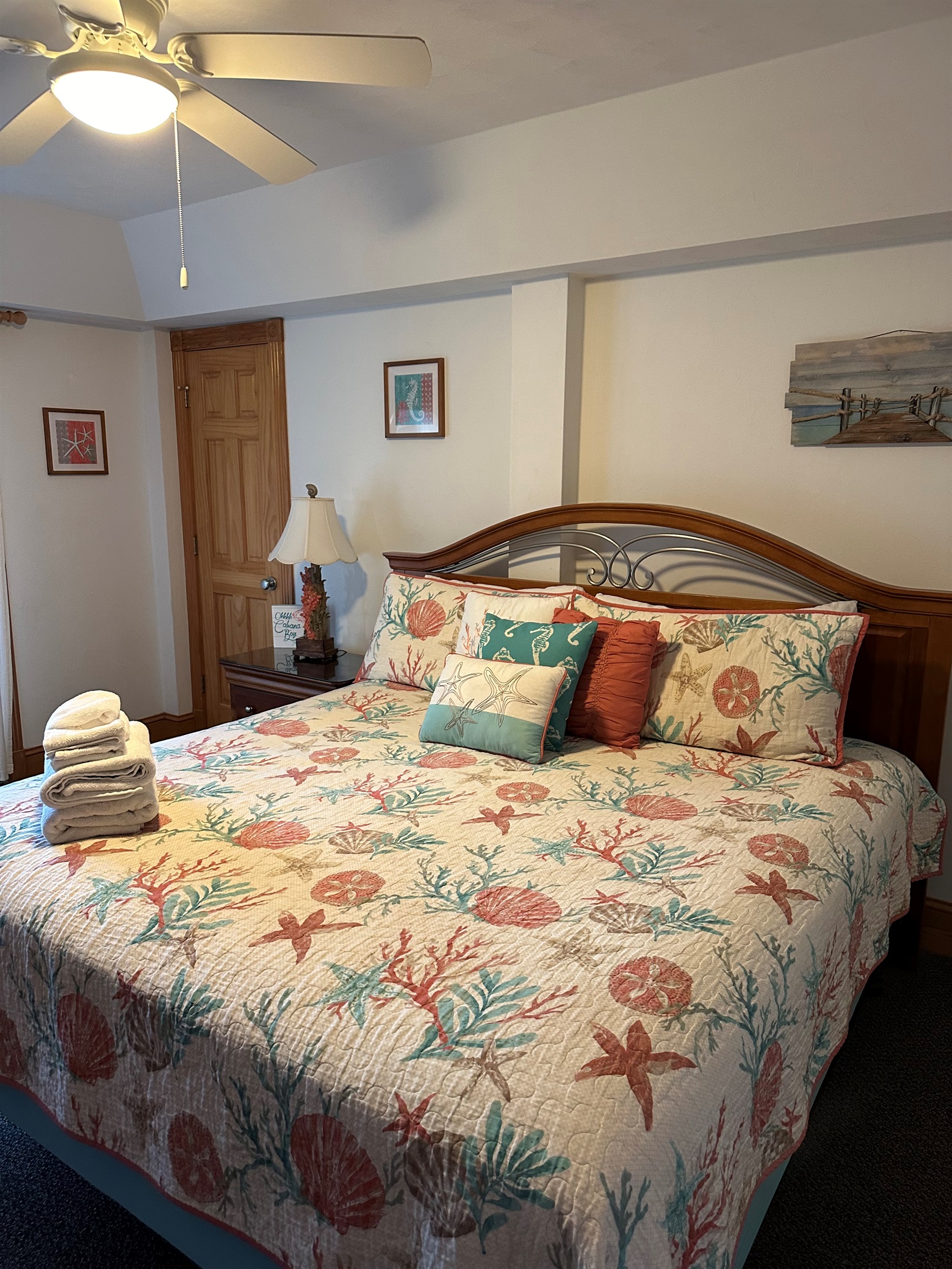 Serene King Master offering access to pool through a windowed entrance and equipped with a TV.