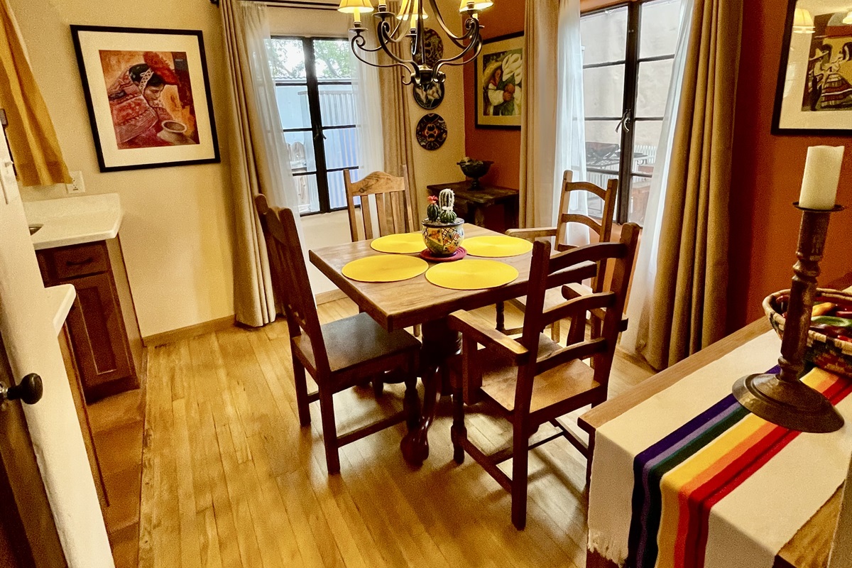 This inviting dining room features a beautiful wooden table, comfortable chairs, and warm natural light.