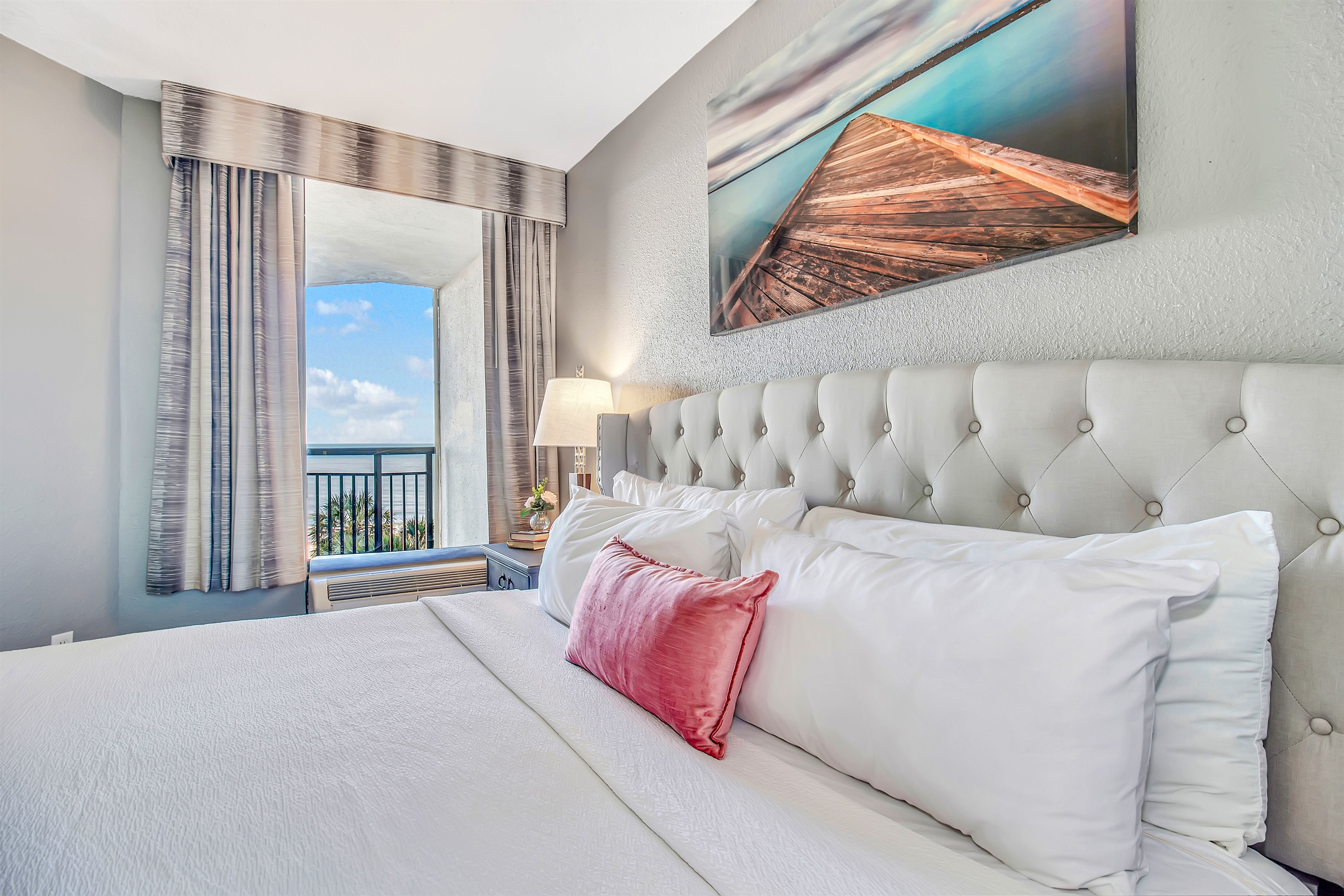 Indulge in a seaside sleeping haven, as the bed in our oceanview suite provides a comfortable and inviting space to recharge while enjoying the coastal scenery.