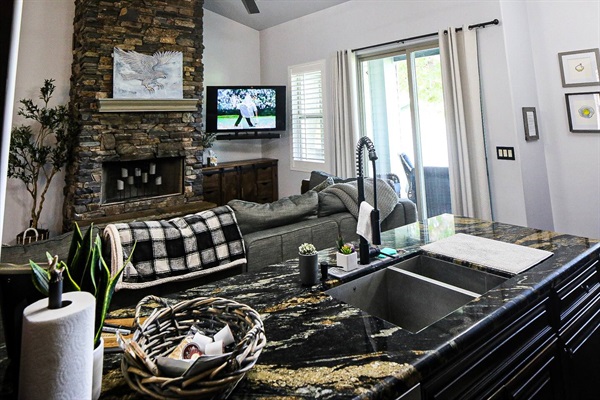 Plenty of seating on the LoveSac couch and eat-in kitchen, with direct view of Payson Golf Course