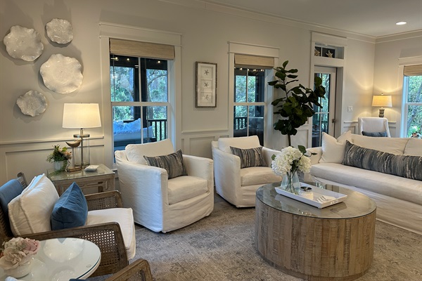 Spacious living room with seating for nine, and an additional four seats at the kitchen counter