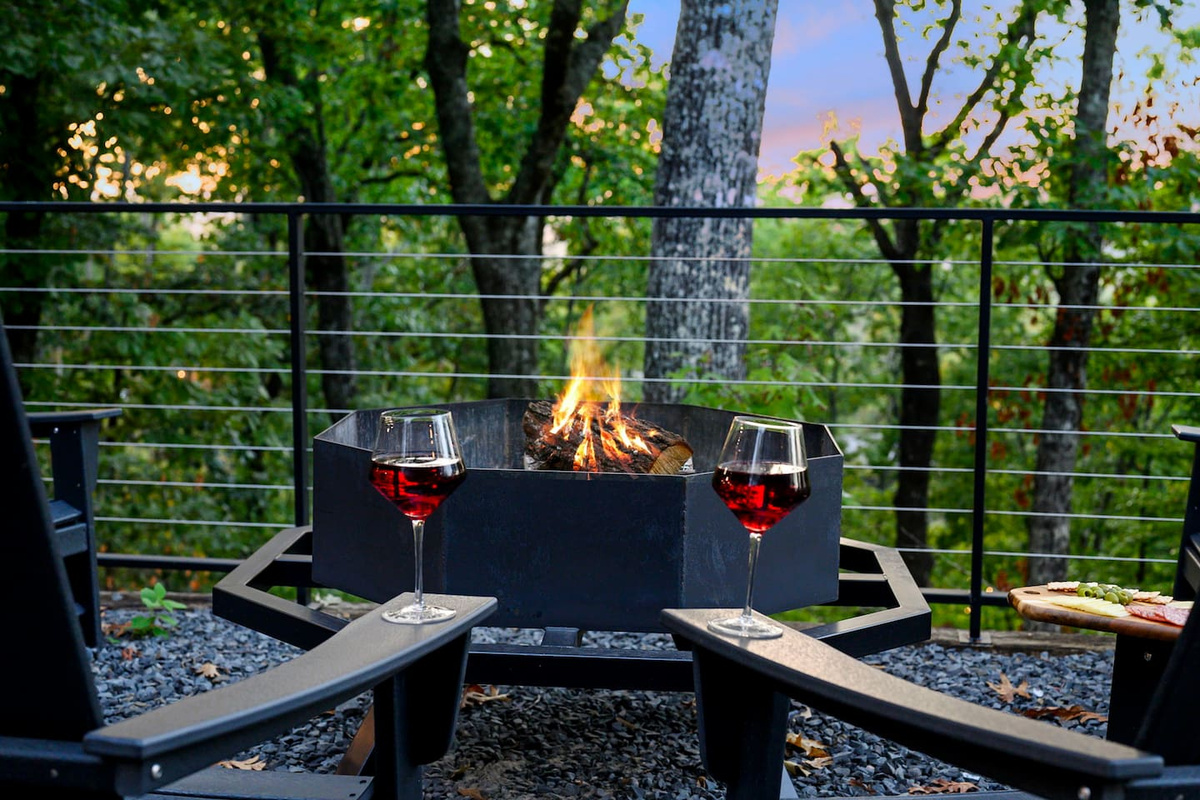 Gather around the fire pit high above the trees, with sweeping forest and mountain views creating the perfect backdrop for cozy evenings under the stars.