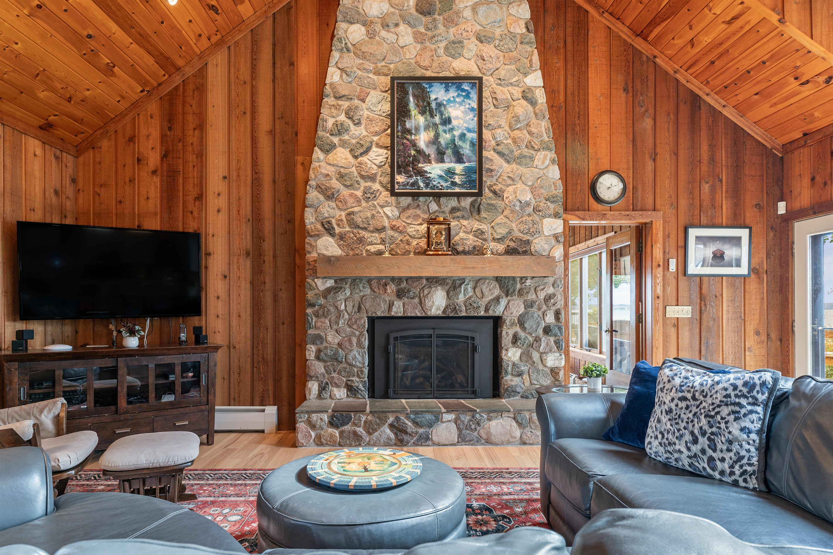 Cozy up by the stone fireplace and enjoy a night in with loved ones