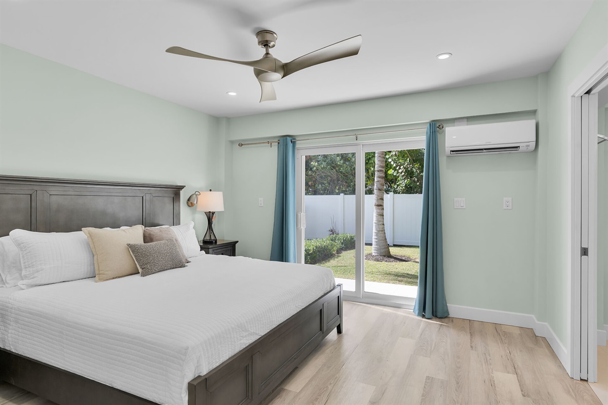 Downstairs guest bedroom with king bed and ensuite bathroom.