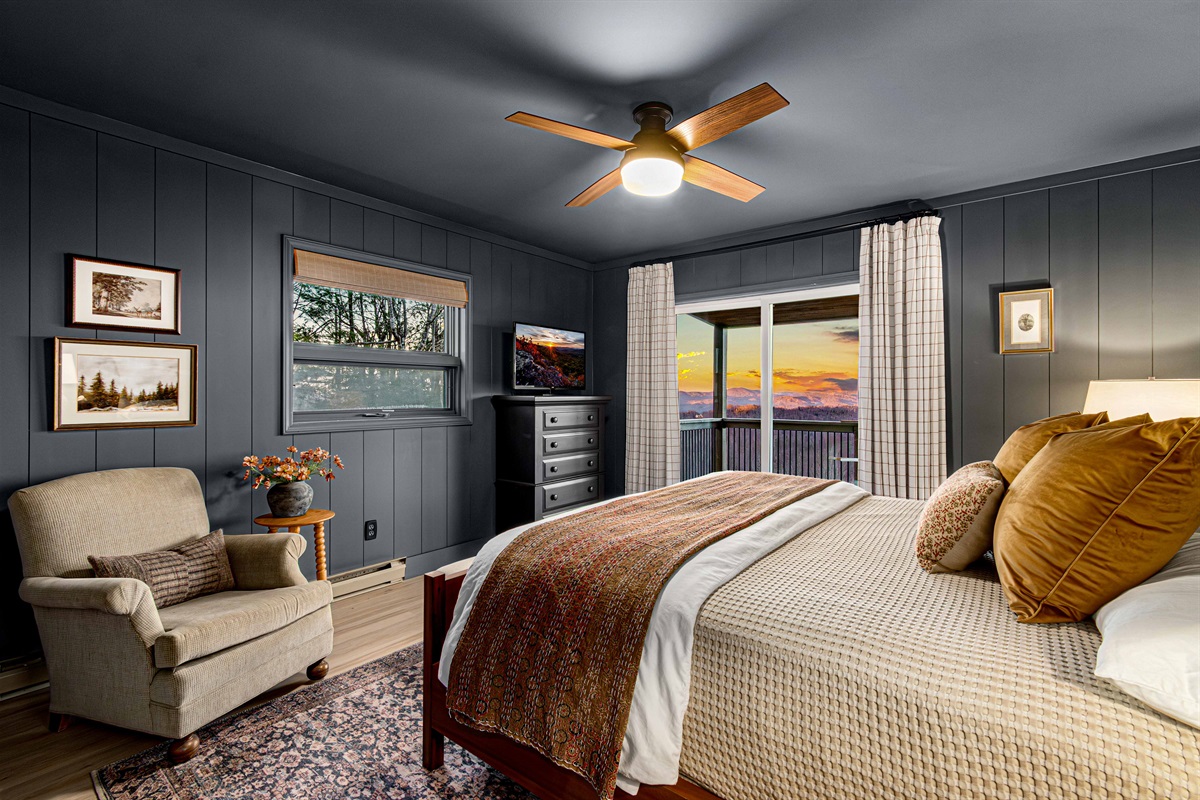 Wrapped in deep slate hues from wall to trim, the Bear Room feels calm, cocooned, and intentionally designed for rest after a day in the mountains.