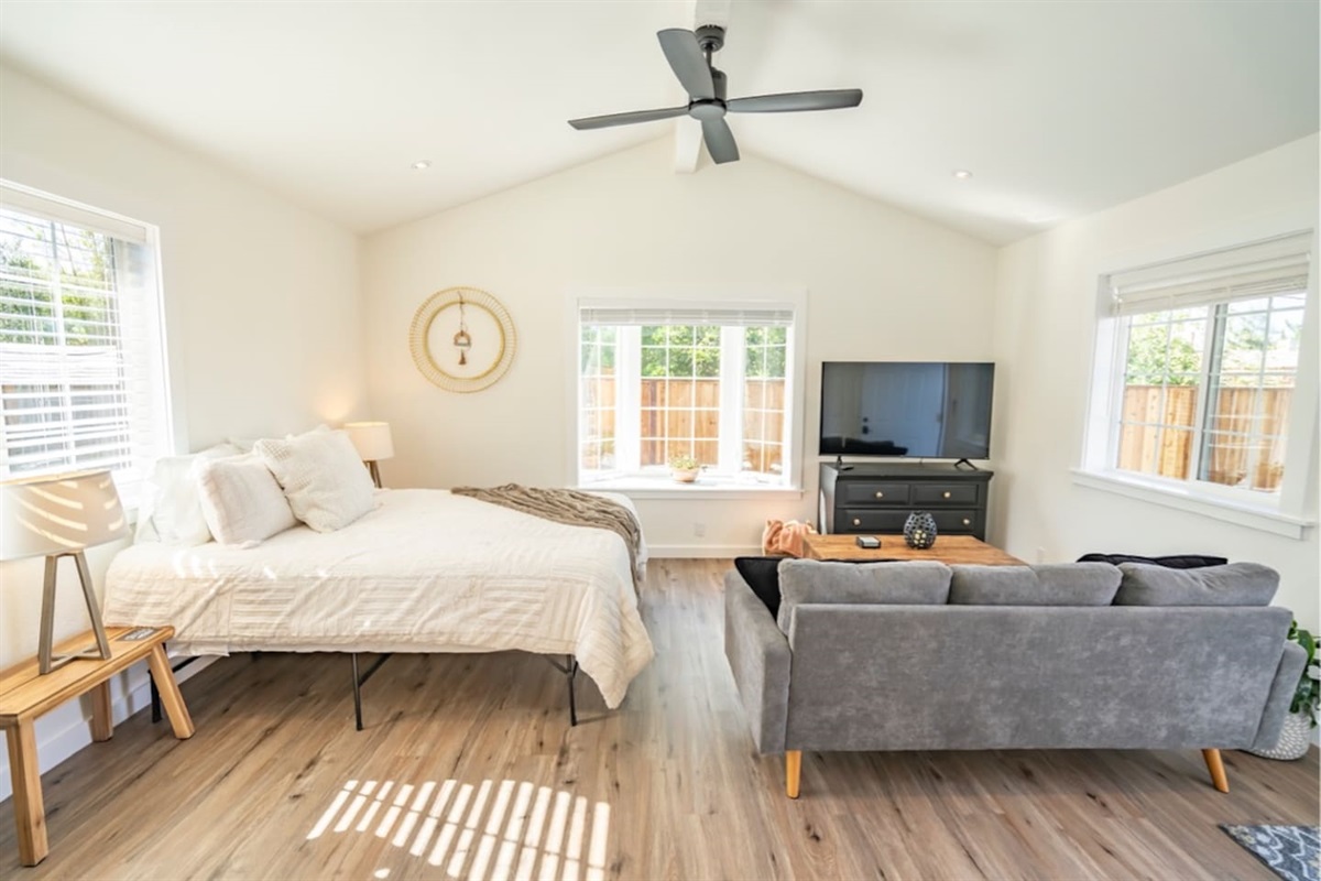 Guest House - Living Area & Queen Bed