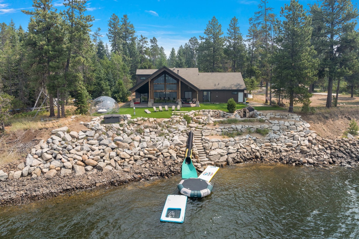 Lakeside luxury retreat with stunning forest views and private dock.