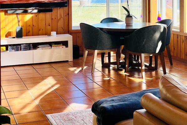 Dining area with warm natural light and space for gathering together.
