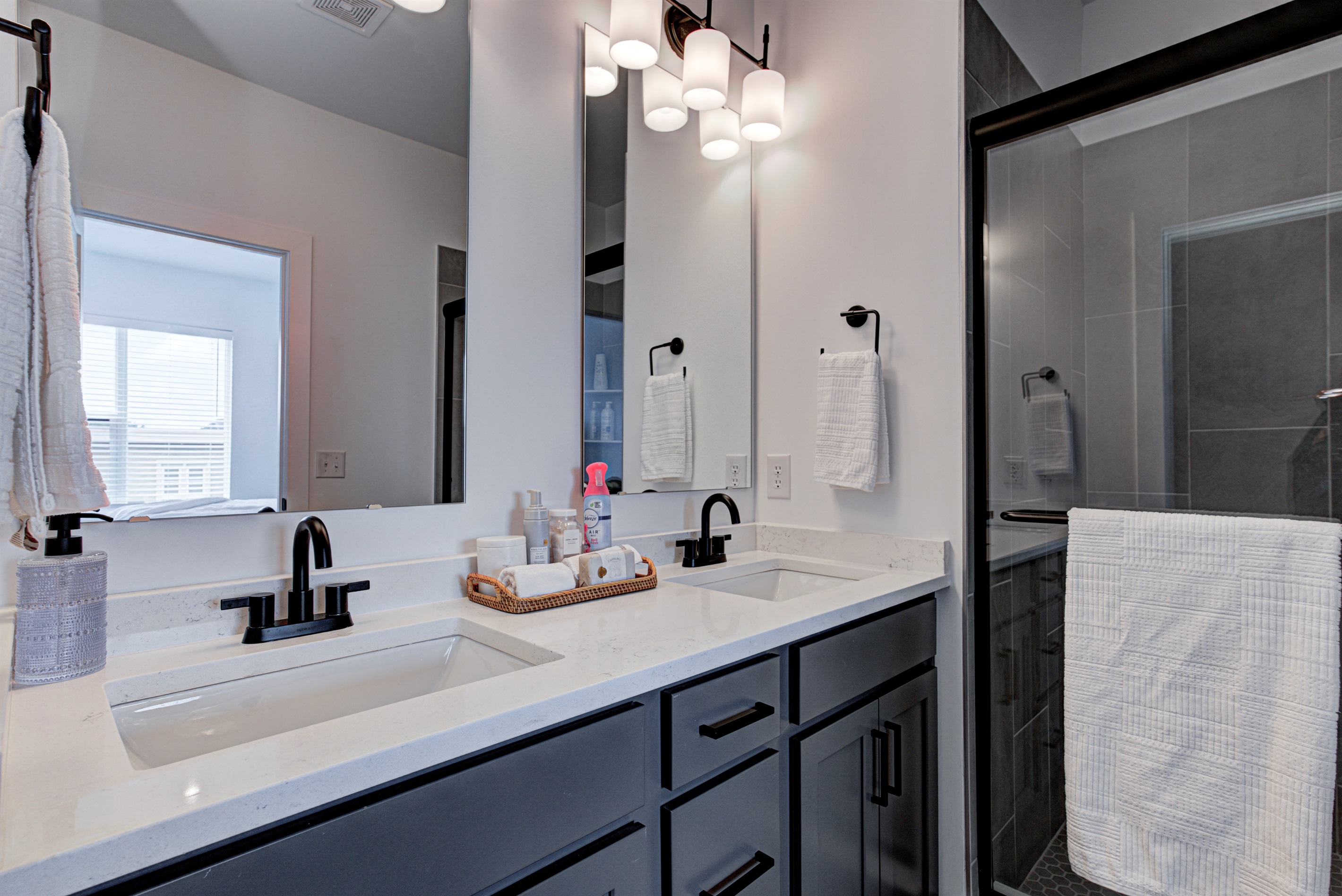 Relax in the serene master bedroom - a comfortable king-size bed, soft linens, and cozy pillows. Includes nightstands, lamps, and walk-in closet. 
