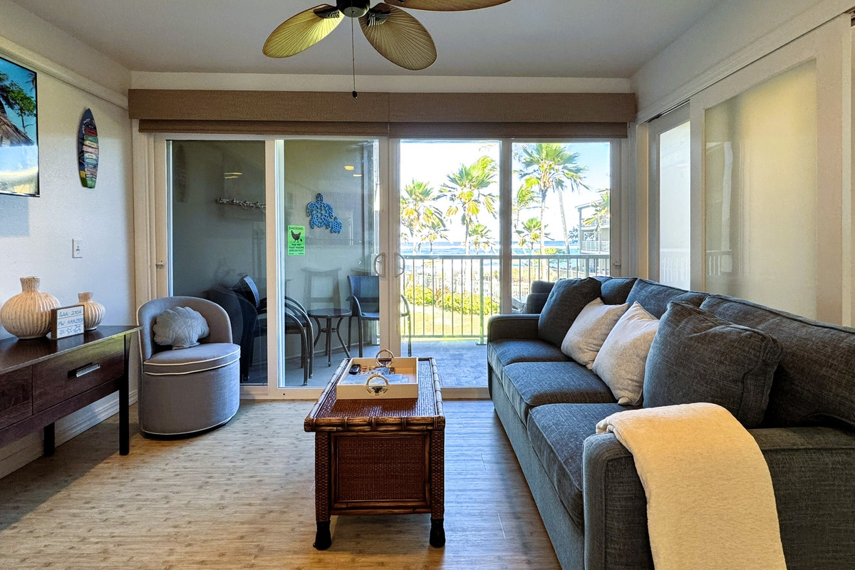 Living room with ocean and pool view