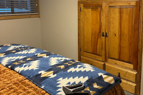 Guest Bedroom - Brand new 43 inch Smart TV with built in cabinets for clothing storage.