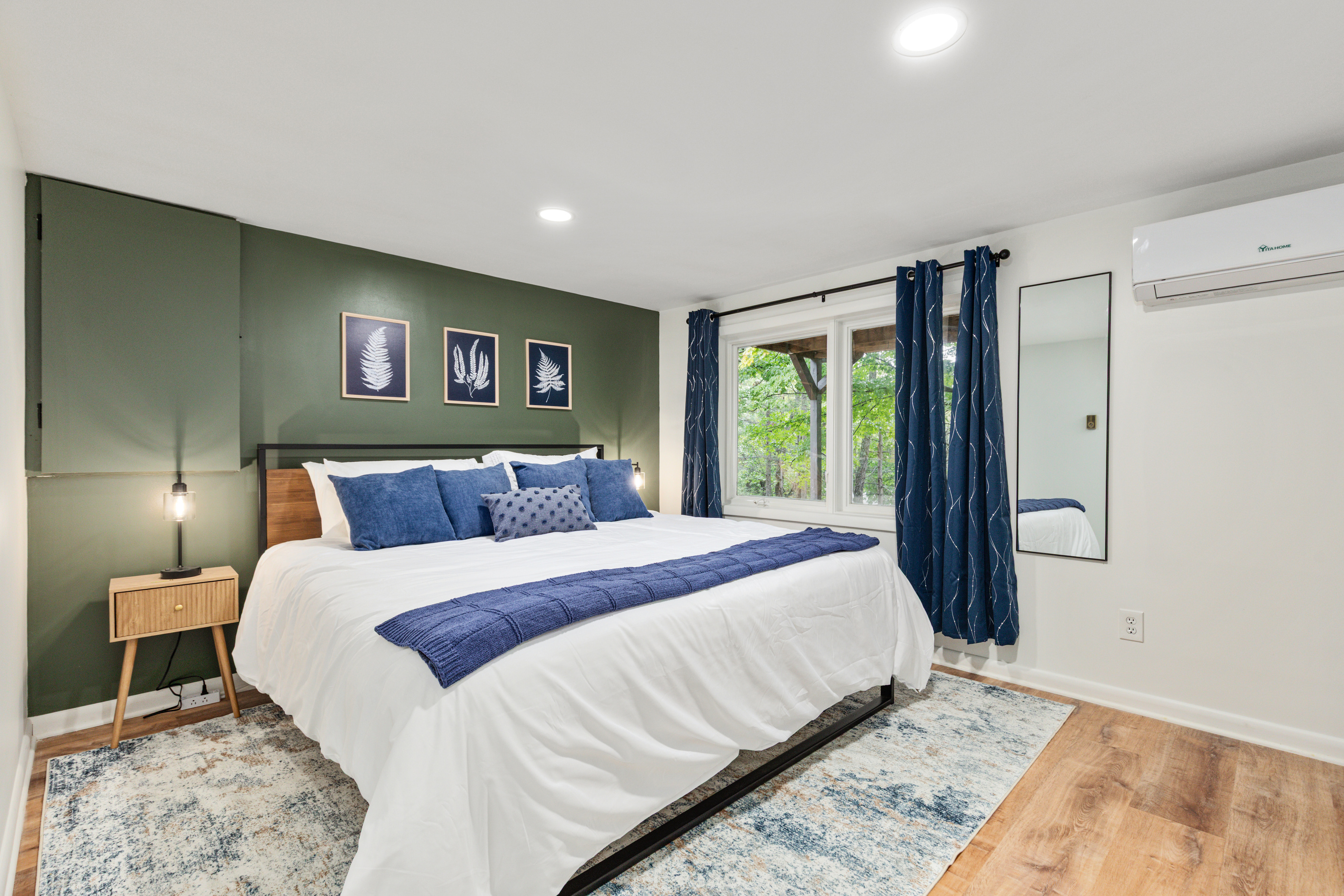 Sink into the king bed after a full day of adventure — plush pillows, calming green tones, and a quiet retreat to recharge.