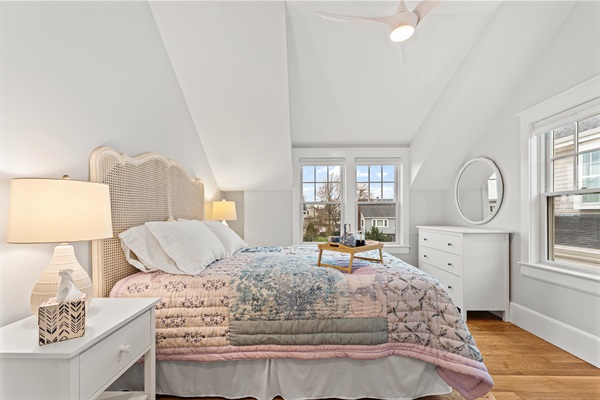 First bedroom featuring a comfortable queen-size bed