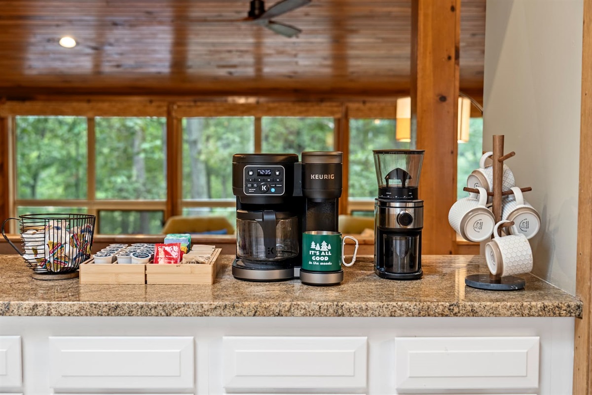 Coffee bar with Keurig dual-option coffee maker.  Option to use K-Cups (small selection provided) or drip coffee (filters provided).  Creamer pods and sugar packets are also provided.