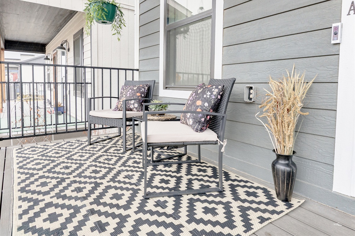 Covered front porch offering a comfortable outdoor retreat—ideal for morning coffee or unwinding in the evening.