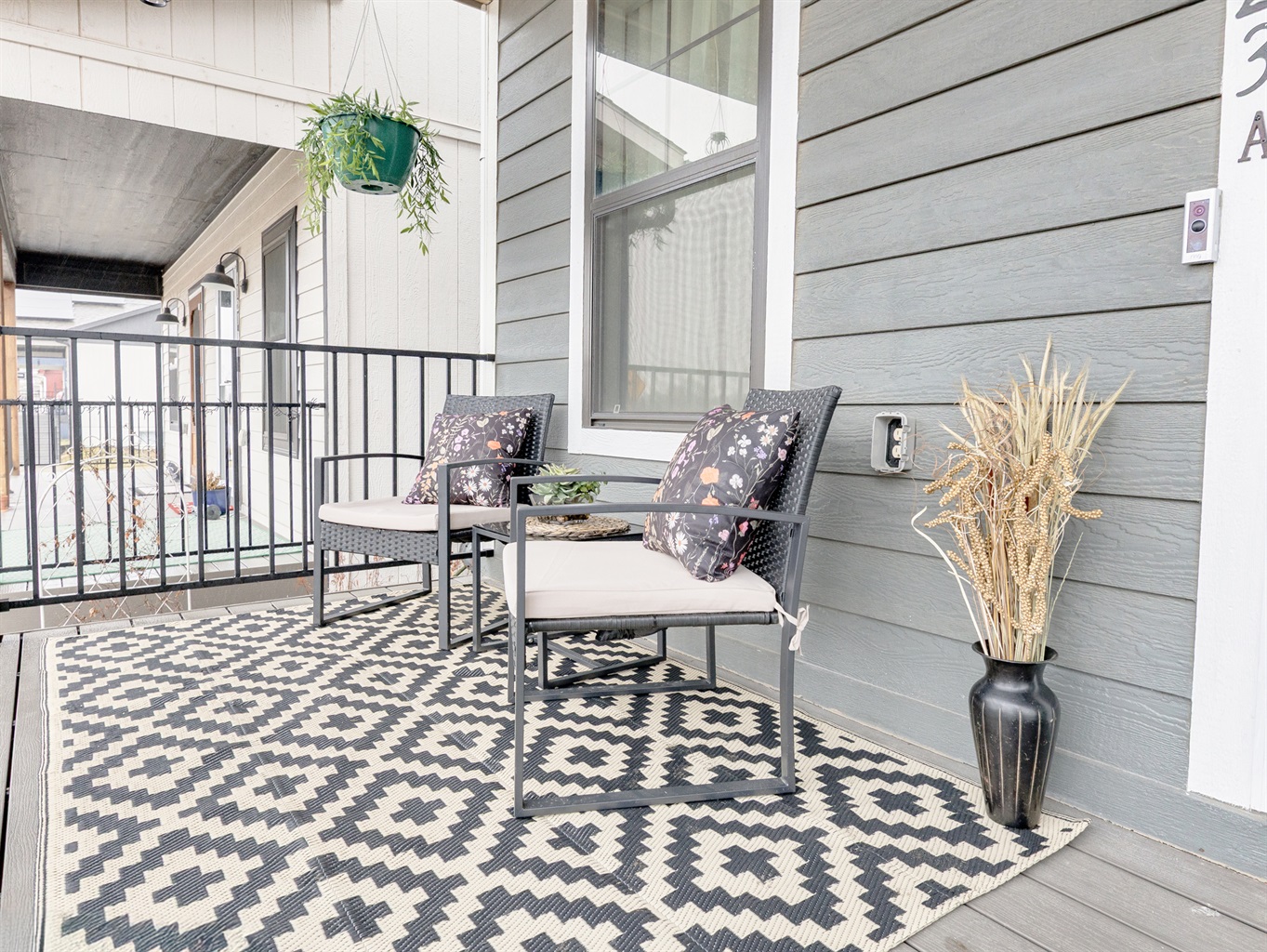 Covered front porch offering a comfortable outdoor retreat—ideal for morning coffee or unwinding in the evening.