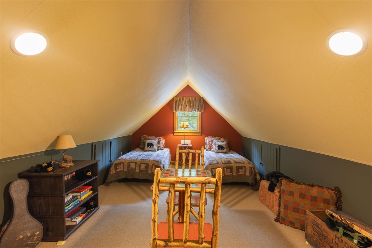 The loft features two twin beds, making it a fun and cozy sleeping space for kids or additional guests.